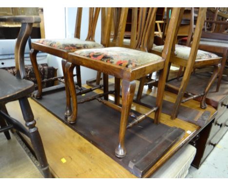 A carved & extending mahogany dining table & four splat back chairs