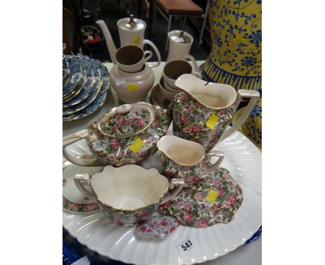 A large blue & white meat dish together with a selection of floral decorated teaware & a Poole part tea service