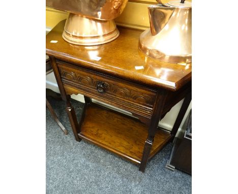 A reproduction carved side table