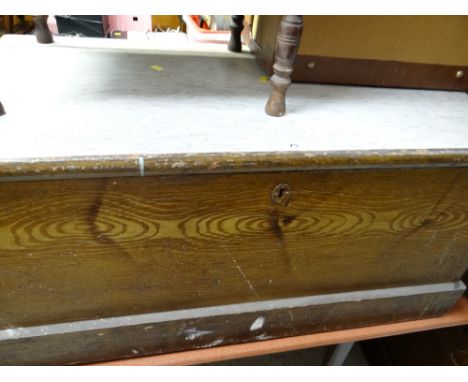 A vintage wooden sailor's chest with iron handles