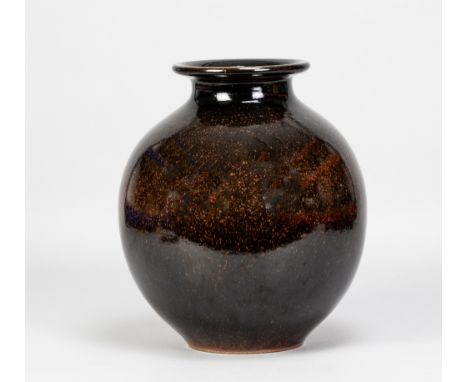 POH CHAP YEAP (1927-2007); a globular stoneware vase covered in tenmoku breaking to kaki glaze, painted signature, made early