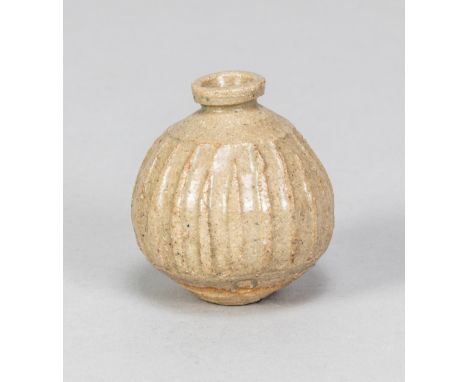 KATHARINE PLEYDELL-BOUVERIE (1895-1985); a miniature fluted stoneware vase covered in oatmeal glaze, impressed KPB mark, made