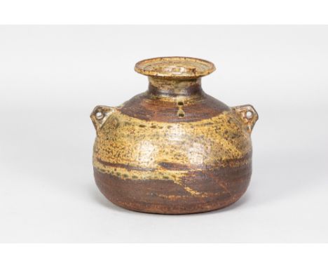 JANET LEACH (1918-1997) for Leach Pottery; a squat stoneware lugged bottle covered in iron and mottled green glaze, impressed