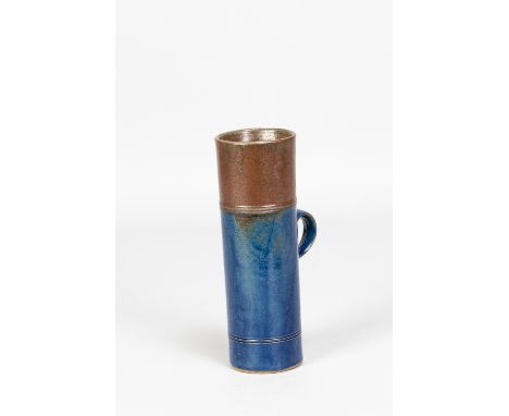 ROBIN WELCH (1936-2019); a tall stoneware tankard covered in indigo and brown glaze, impressed mark, made 1970s, height 18cm.