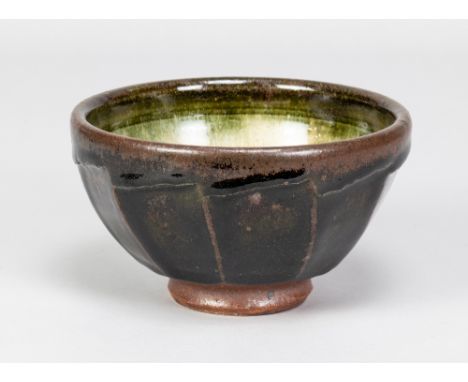 RICHARD BATTERHAM (born 1936); a cut sided stoneware footed bowl covered in tenmoku and green ash glaze, made 1990s, diameter