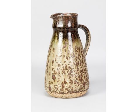 BARBARA CASS (1921-1992); a tall tapered stoneware jug partially covered in running green glaze with iron top, incised BC Ard