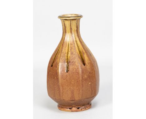 JIM MALONE (born 1946); a cut sided stoneware bottle covered in brown and running green ash glaze, impressed JM and A (for Ai