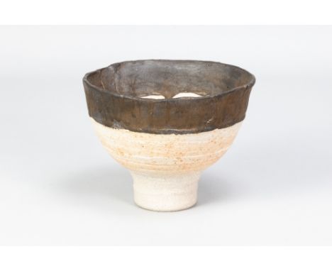 ROBIN WELCH (1936-2019); a stoneware pedestal bowl with chocolate glazed top and mottled orange glaze partially to well, impr