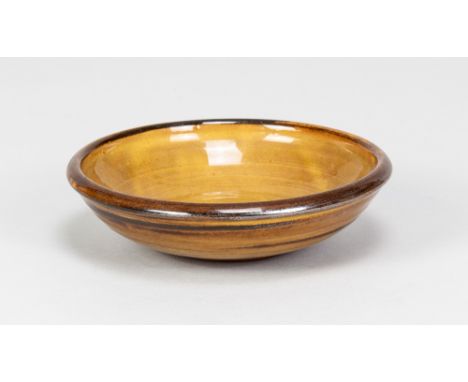 MARGARET LEACH for Taena Pottery; a small shallow slipware bowl, impressed pottery mark, made early 1950s, diameter 14.5cm. (