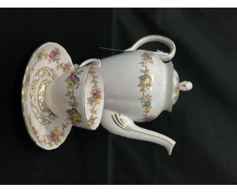 TUSCAN COFFEE SERVICEcomprising six cups, six saucers, coffee pot, sugar and cream along with a bone china half tea service d