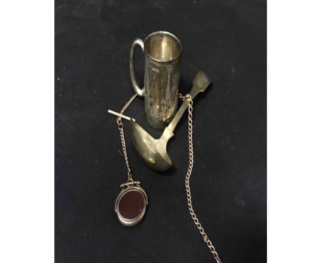 NINE CARAT CHAIN with yellow metal fob along with a silver christening cup and a white metal toddy ladle 