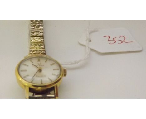 Ladies gilt Omega wrist watch with silver dial   