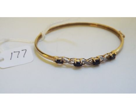 A sapphire & diamond set 9ct bangle     