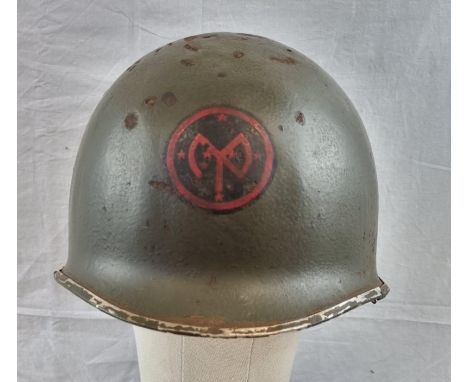 WW2 US M1 Swivel Bale Helmet Front Seam Helmet with insignia of the 27th Infantry Division. 