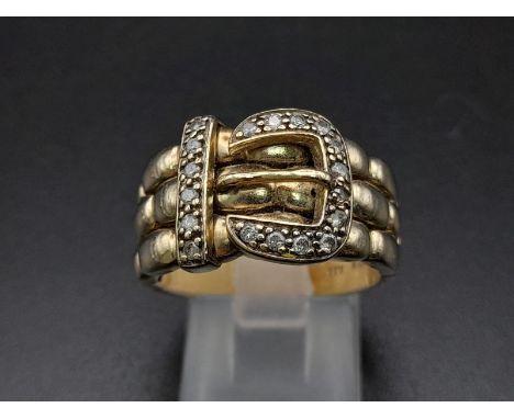 A 9K Yellow Gold and Diamond Buckle Ring. 18 diamonds .25ct complement this keeper piece. Size Q. 9.6g total weight. Ref -363