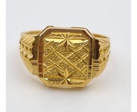 A 22K Yellow Gold Signet Ring. Pierced and engraved decoration. Size V. 9.1g. Ref - 9212. Ring slightly bent so a/f. 