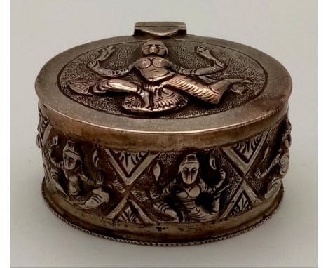 An Antique Burmese Solid Silver Snuff or Pill Box. Wonderful embossing decoration throughout. Good condition. 5 x 4cm. 