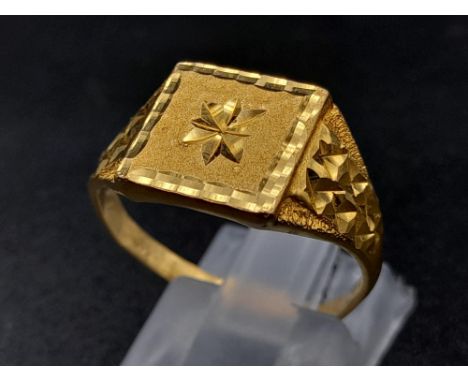 A 22K Yellow Gold Star-Design Signet Ring. Size R. 4.8g.Note: This ring is slightly bent on the back so A/F. Ref - 1137 