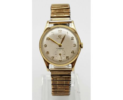 A Vintage Cyma 9K Gold-Cased Watch. Expandable strap with gold case - 28mm. Second sub dial. Mechanical movement. In working 