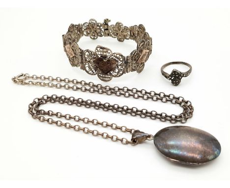 Three Wonderful Antique Silver Items: Chain with locket, marcasite ring - size O and a pierced and filigree decorated bracele