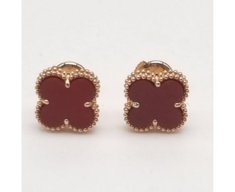 A Pair of 18K Rose Gold Van Cleef and Arpels Alhambra Carnelian Stud Earrings. Light and delicate they are a discreet way of 