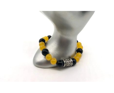 A Black Onyx and Mashan Jade Expandable Bracelet. 