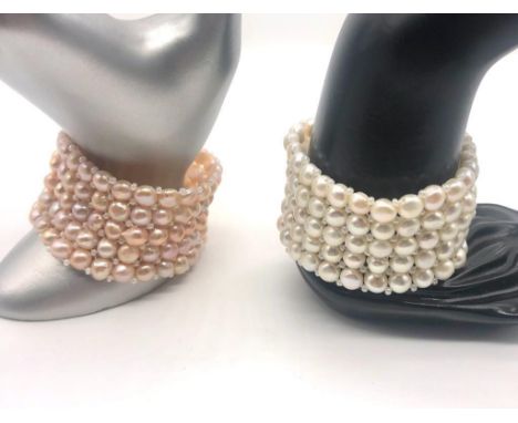 Two Freshwater Pearl Flat-Back Button Cuff Bracelets. White and pink expandable five-row bracelets. 