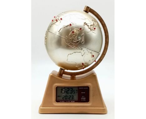 A Global World Time Zone Desk Clock. Move the globe to see different world times. In good condition and working order. 13 x 2