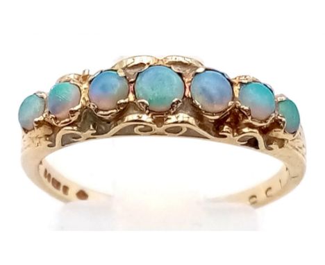 An Antique 9K Yellow Gold Opal Ring. Seven graduating opal gemstones. Size M. 1.94g total weight. 