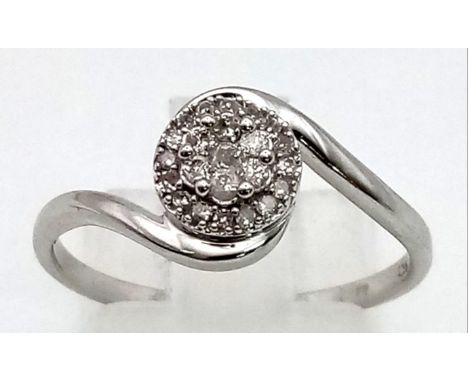 A 9K White Gold Diamond Crossover Cluster Ring. Size P. 1.94g total weight. 