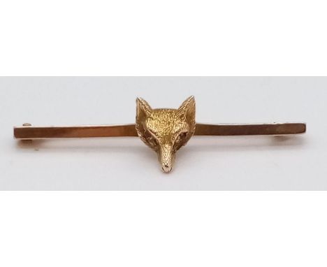 A Vintage 9K Yellow Gold Fox Brooch with Ruby Eyes. 3.5cm. 2.2g total weight. 
