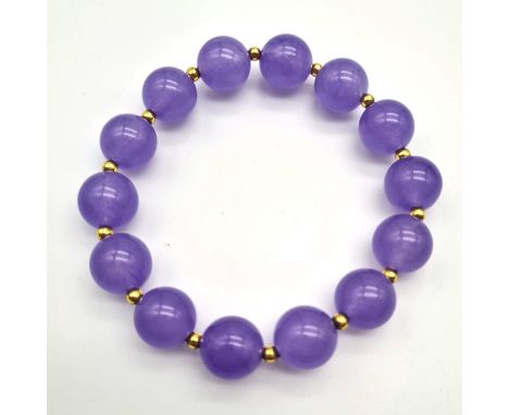 A Lavender Jade Expandable Beaded Bracelet. Beads - 10mm. Gilded spacers. 