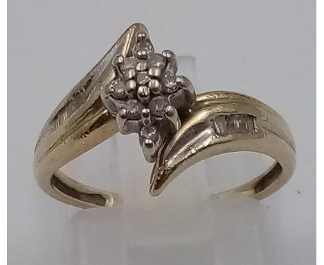 A 10K GOLD DIAMOND SET TWIST CLUSTER RING. .20ct DIAMONDS . 2.2gms  size L 