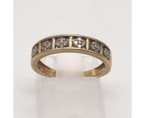 A 9K Yellow Gold Diamond Half-Eternity Ring. Six x four squares of small diamonds. Size L. 1.92g total weight. 