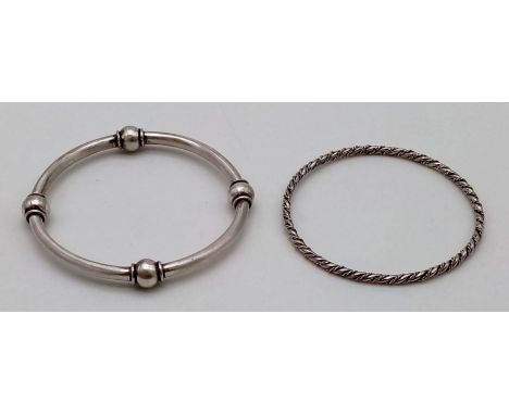 Two Eclectic Vintage Silver Bangles. 26.75g total weight.7cm inner diameter. 