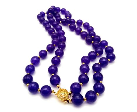 A Purple Jade Two-Strand Bead Necklace with Gilded Spacers and Clasp. 42cm. 12mm beads. 