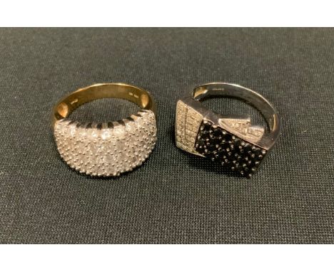 A modern design black and white diamond stepped platform dress ring, 9ct white gold shank, size 1Q, Birmingham 375 marks;  an
