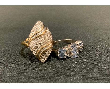 A 9ct gold diamond panel ring, arched marquise crest, pave set with round brilliant and baguette cut diamond accents, 9ct gol