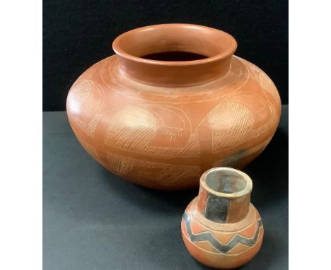 A Hopi Indian incised redware bowl planter, decorated with traditional motifs, in the manner of Nampeyo, 28.5cm wide;  a smal