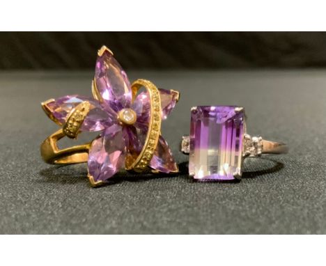 A contemporary diamond and pale pink stone flowerhead dress ring, 9ct gold shank, size R, 6.7g gross;  a banded two tone purp