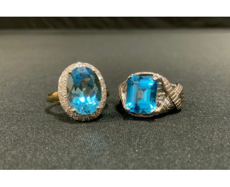 A vibrant blue stone possibly Topaz and diamond oval QVC dress ring, 9ct gold shank, size R;  another rectangular, 9ct gold s