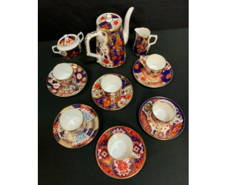 A Royal Crown Derby six piece tea service comprising six teacups, saucers, tea pot, sucrier and a sugar jug, various patterns