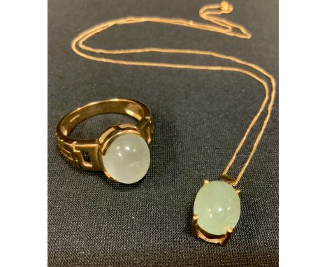 A 9ct gold chatoyant quartz cabochon dress ring, size R, 6.4g gross;  a similar pendant necklace, 2.9g gross (2) 