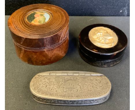 A 19th century turned wood cylindrical table snuff box, the cover set with circular cartouche of a comical character, 7cm dia