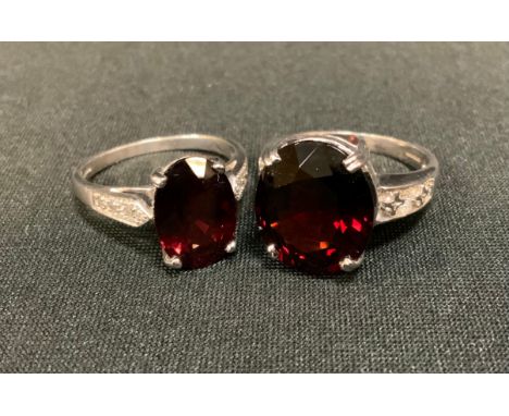 A 9ct gold garnet dress ring, another, 9ct white gold shanks, Birmingham marks, Size R, 12g gross (2) 