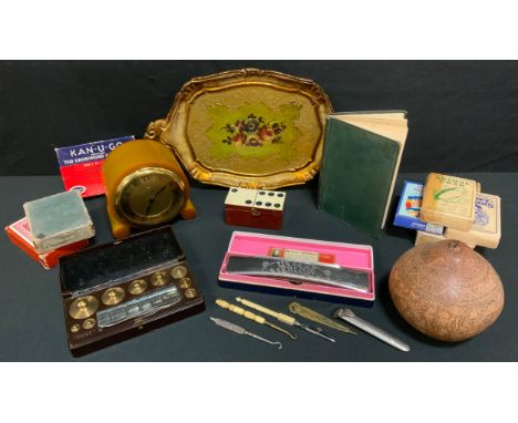 A carved tribal gord;  Art Deco Temco mantel clock, Hohner Harmonica ; playing cards etc. 