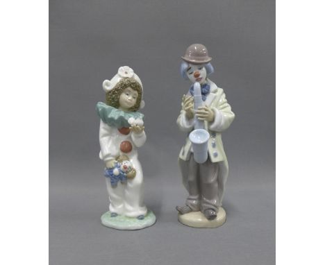 Lladro 'Sad Sax' porcelain figure and a Nao figure of a child dressed as a clown, both with original boxes, tallest 23cm (2) 