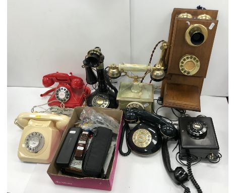 A vintage mahogany cased and brass wall mounted telephone with twin bells 23 cm wide x 45 cm high together with a vintage bla