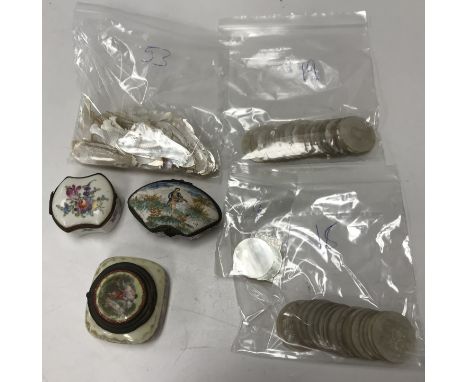 A collection of mother of pearl counters including fifty-three fish, nineteen circular examples with wavy edges, eighteen wit