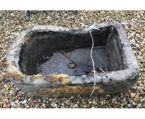 A natural stone D end trough, 66 cm wide x 41 cm deep x 25 cm high